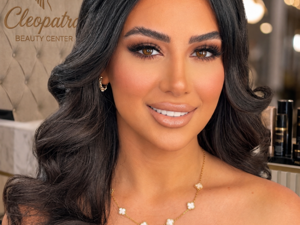 High-glamour bridal makeup and elegant voluminous hair waves transformation by Cleopatra Beauty Center in Sterling Heights, Michigan.